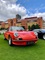Red Porsche 911 Classic parked on the grass at London Concours 2019.
