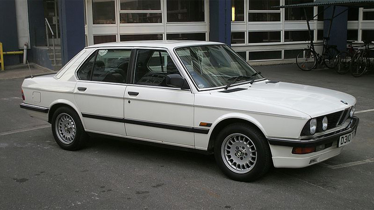White BMW 5 Series, parked