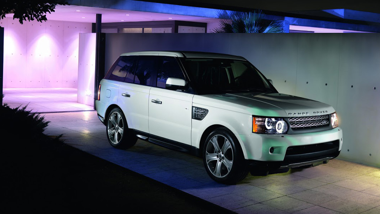 Range Rover Sport parked in front of a contemporary house