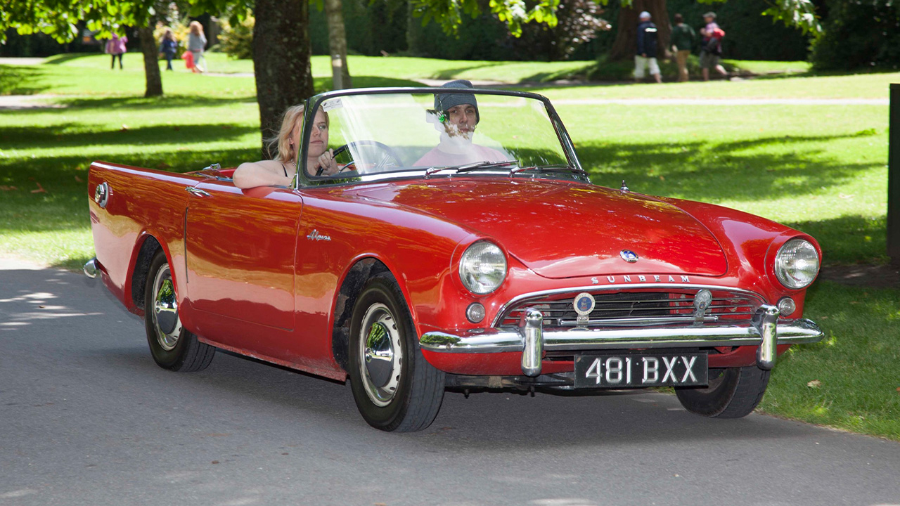 Red Sunbeam Alpine, driving with the roof down