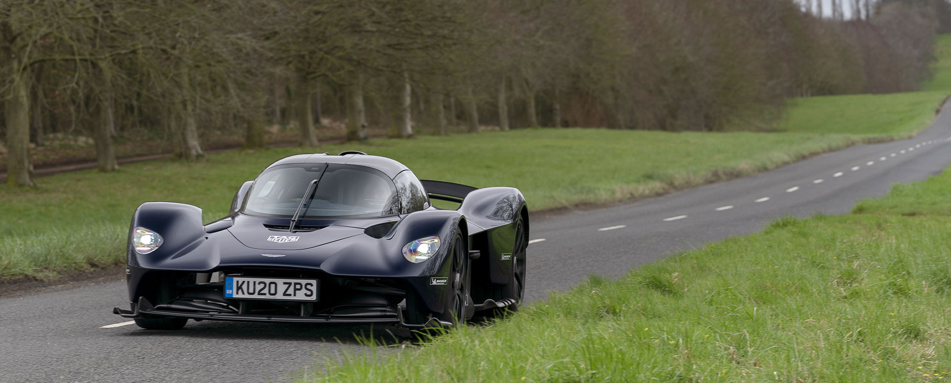 Black Aston Martin Valkyrie, driving
