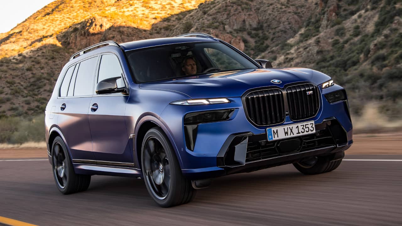 BMW X7 in Blue Driving front angle