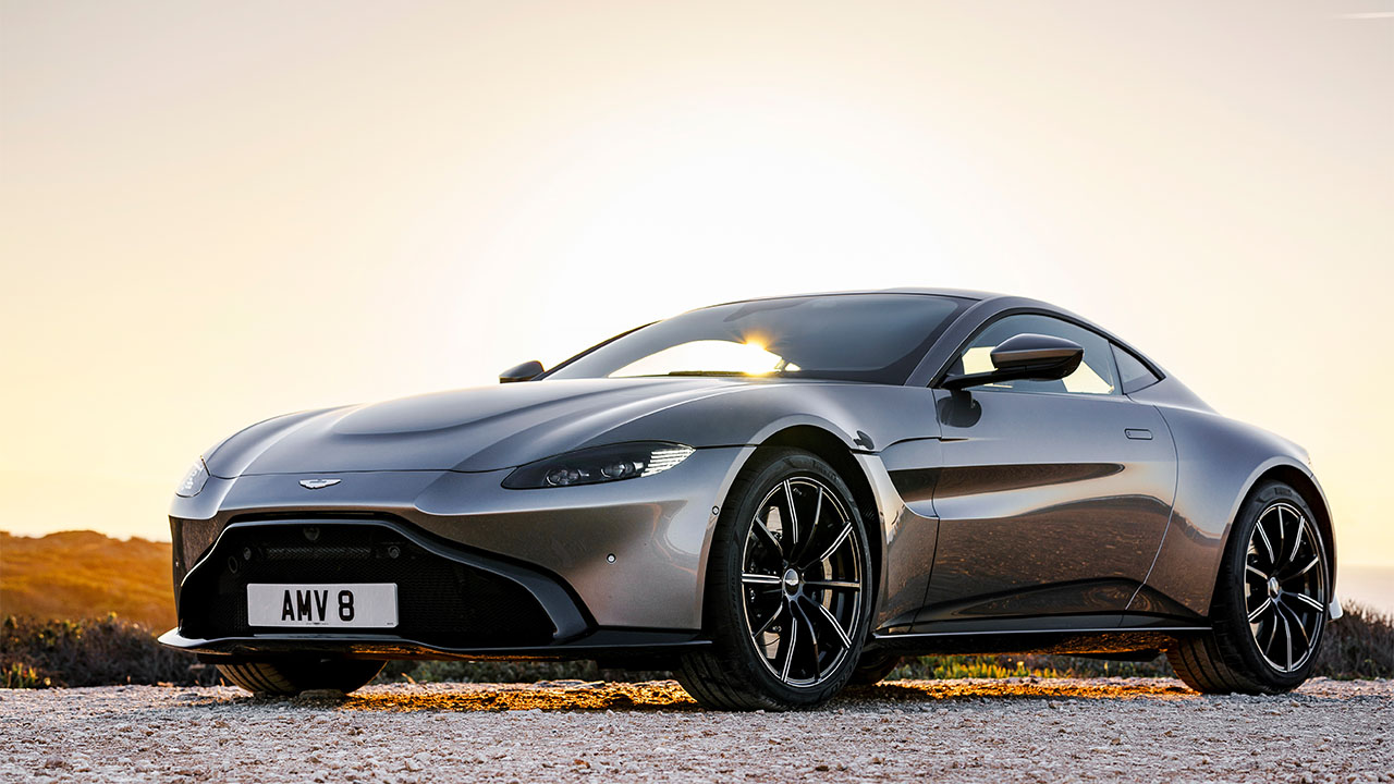 Grey Aston Martin Vantage, parked in sunset