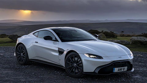 Grey Aston Martin Vantage, parked in sunset
