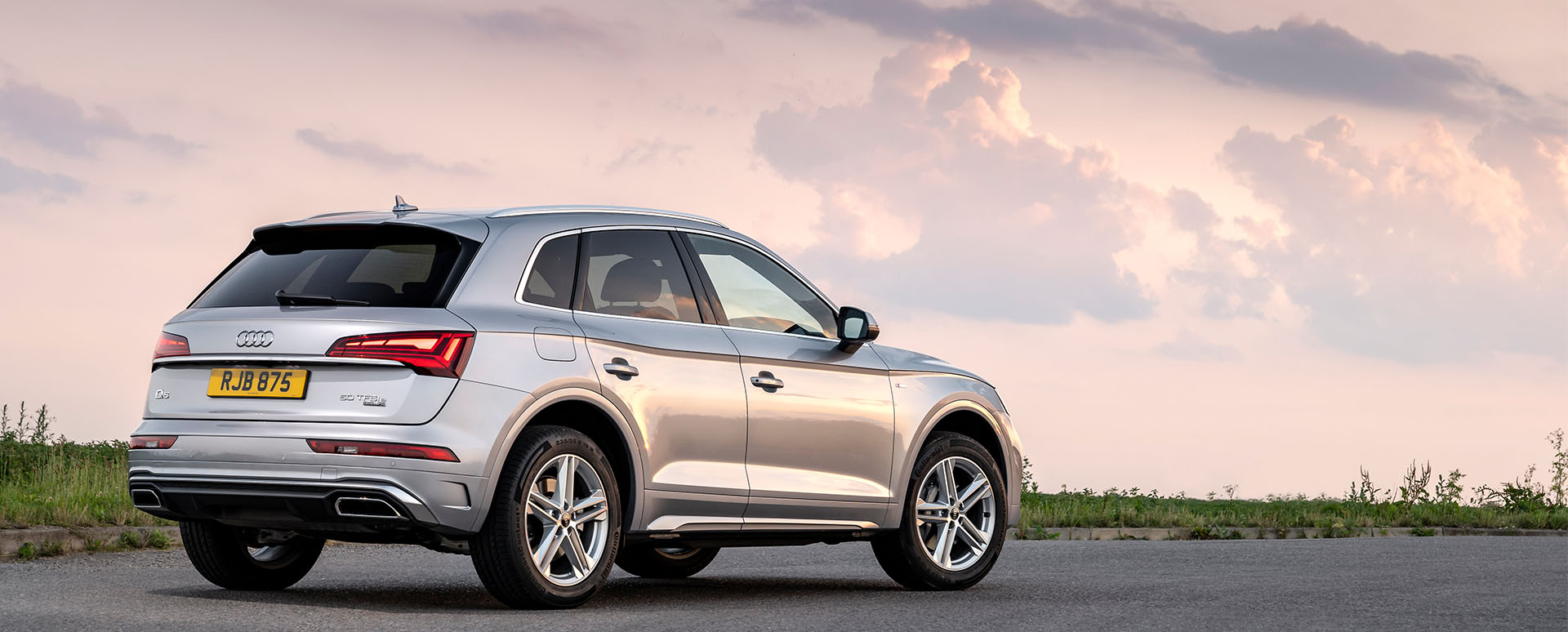 Silver Audi Q5, parked in sunset
