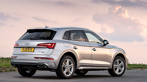 Silver Audi Q5, parked in sunset
