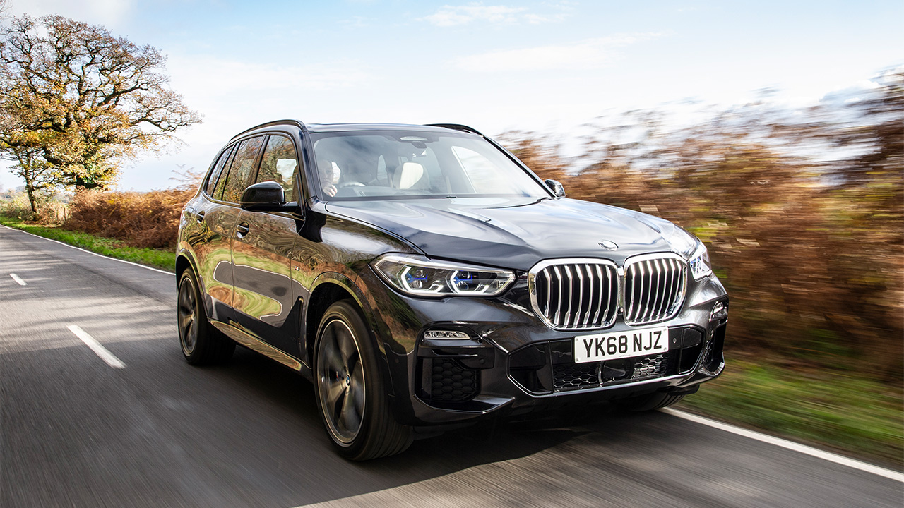 Black BMW X5, driving