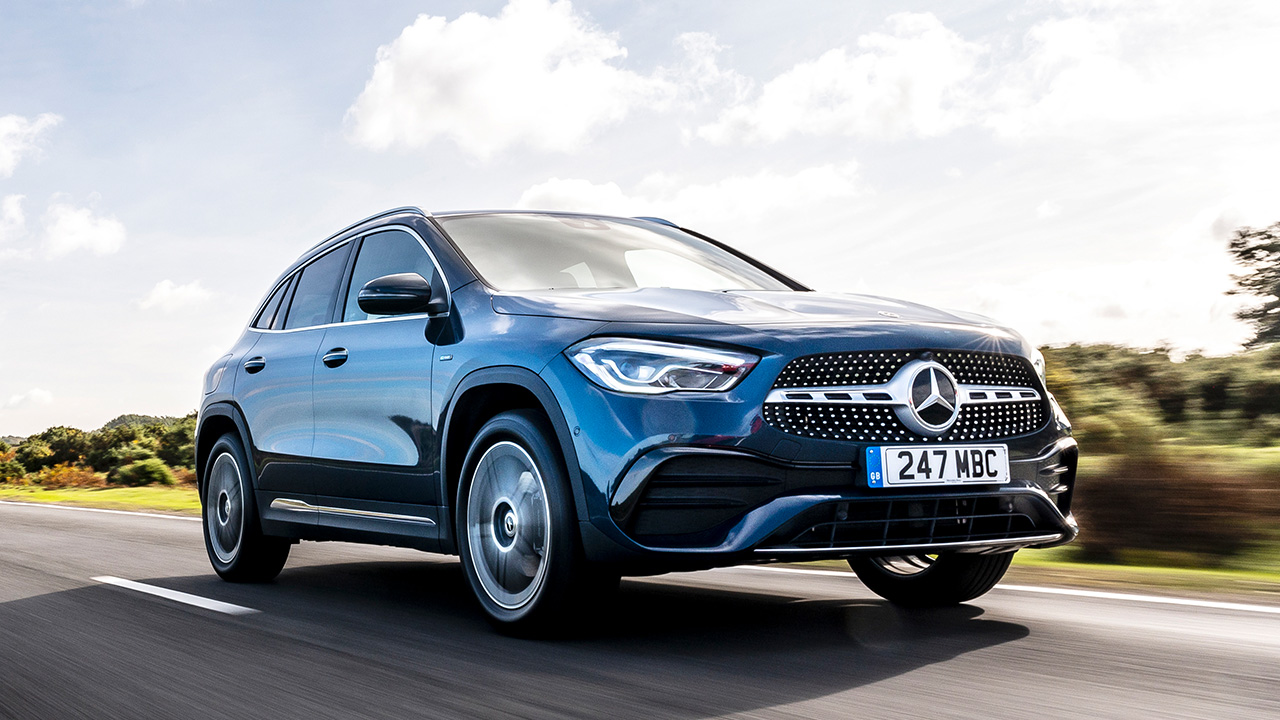Blue Mercedes-Benz GLA, driving down country road