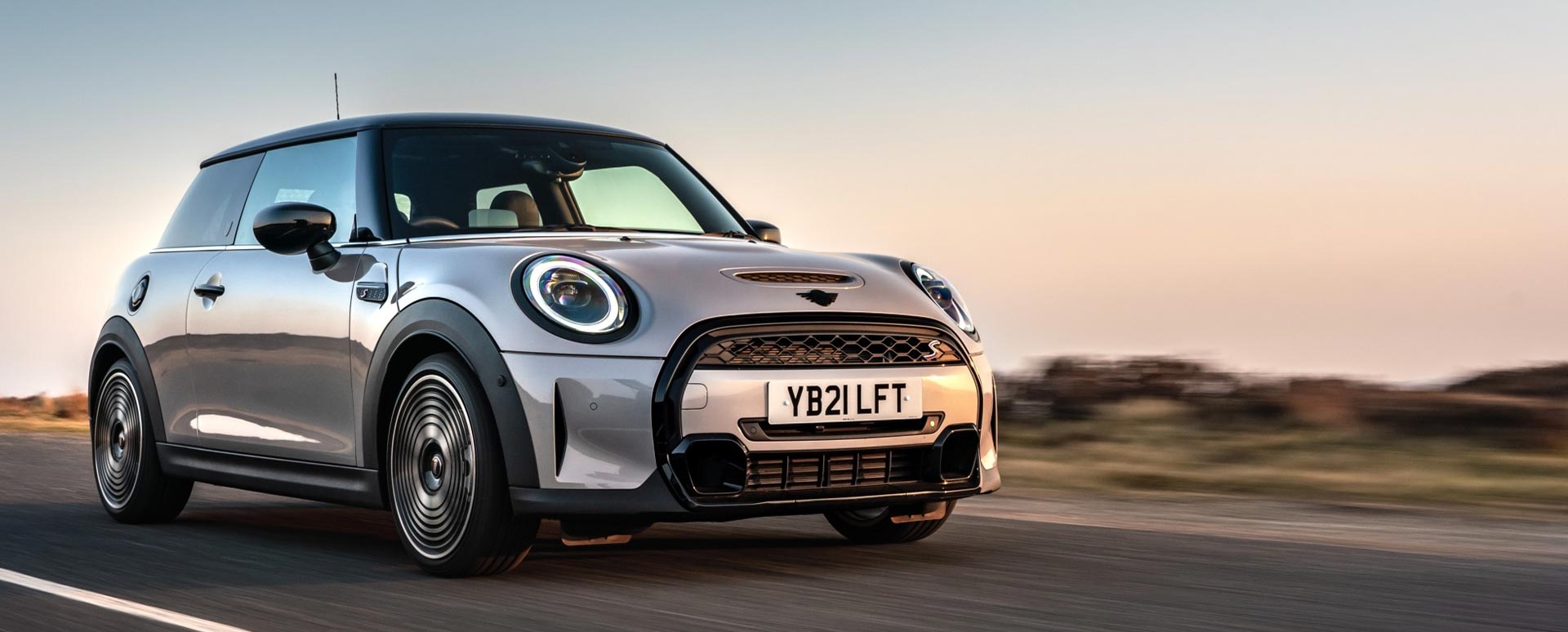 MINI Hatchback, driving in sunset