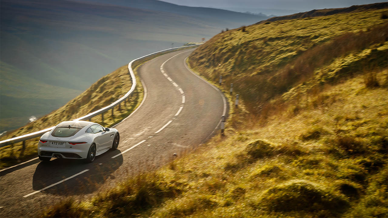 jaguar f-type driving in hills