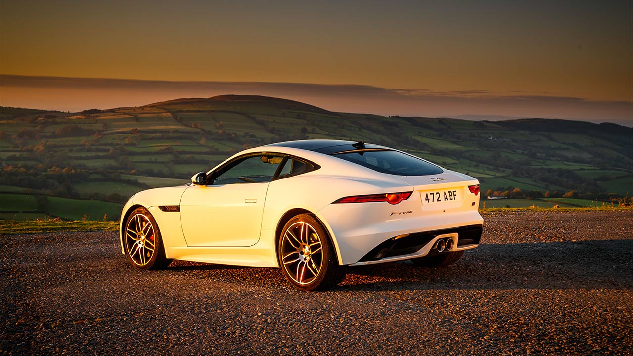jaguar f-type parked in sunset
