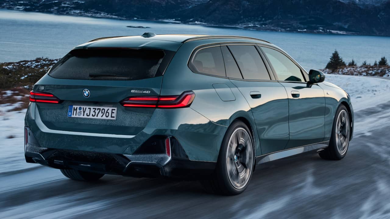 BMW i5 Touring Driving on Icy Road