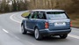 Blue Range Rover, rear driving shot