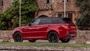 Red Range Rover Sport, parked side shot