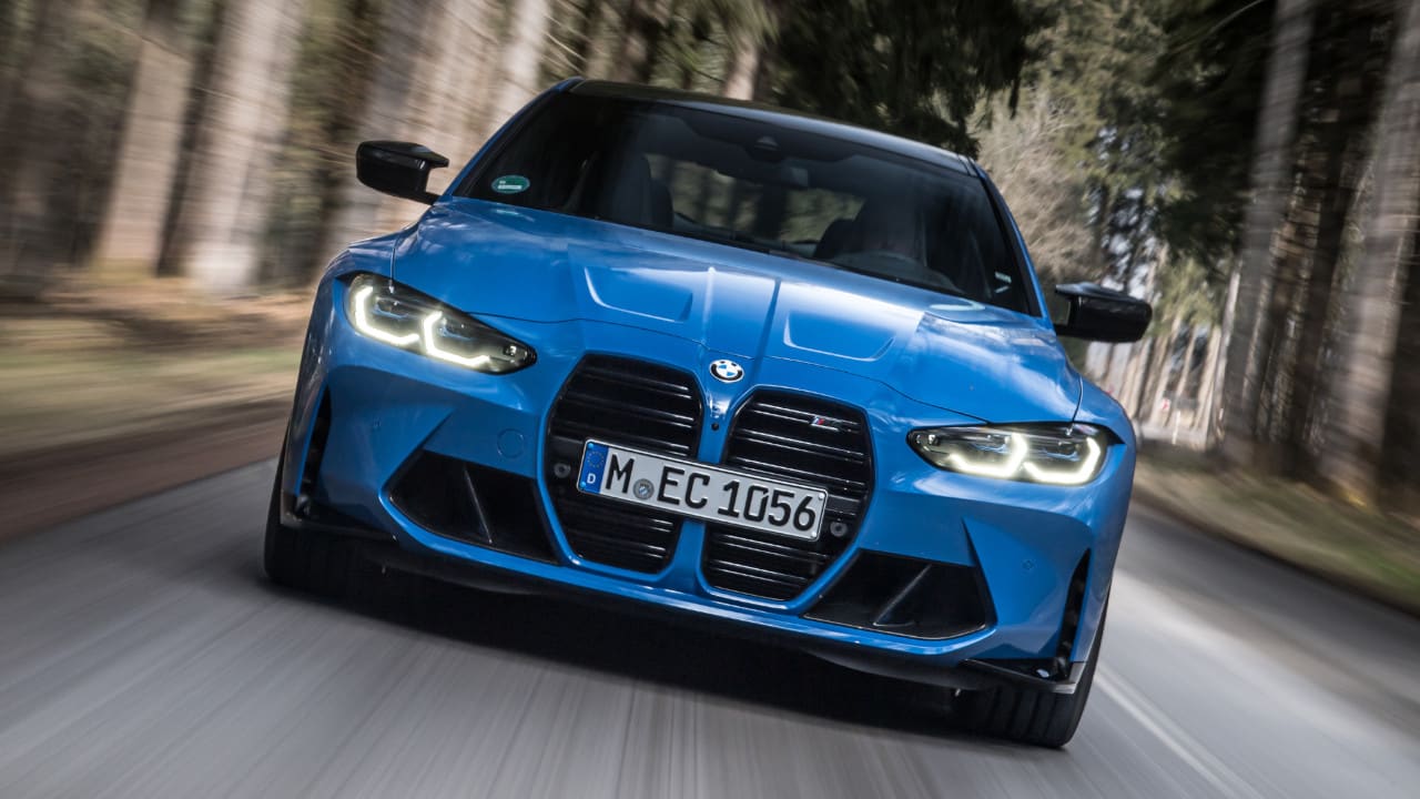 Blue BMW M4 Competition Exterior Front Driving