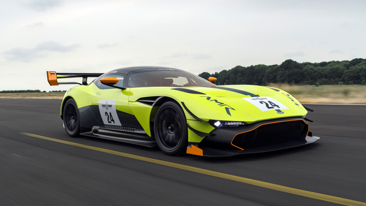 Yellow Aston Martin Vulcan with AMR Pro Package Driving on a Race Circuit in the Daytime