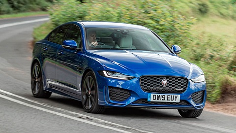 Blue Jaguar XE front quarter driving shot