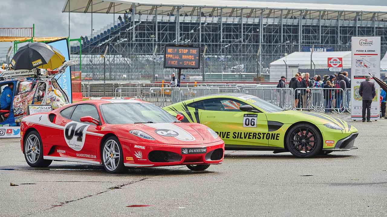 An Aston Martin Vantage and Ferrari 458 at Silverstone Classic