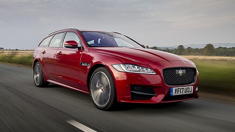 Red Jaguar XF Sportbrake, driving through the countryside