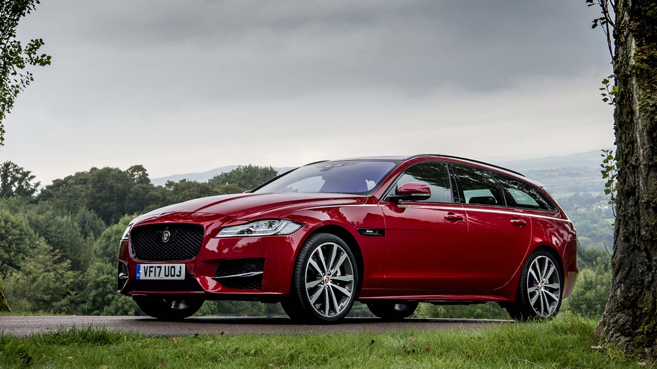 Red Jaguar XF Sportbrake, parked in countryside