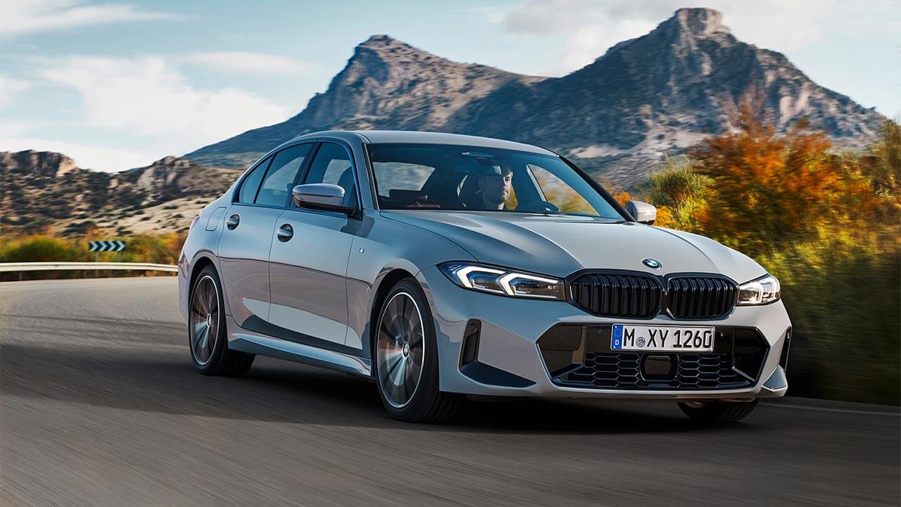 BMW 3 Series driving in the countryside