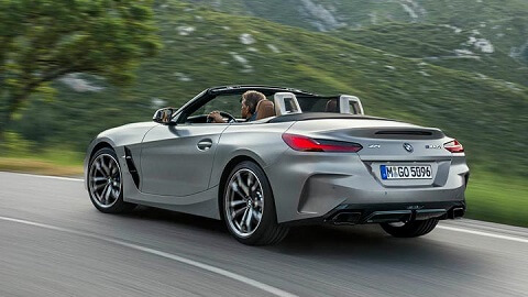 Grey BMW Z4 M40i driving in the countryside with the roof retracted