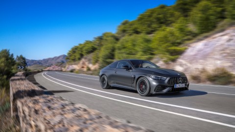 Black Mercedes-AMG C-Class Exterior Front Driving Country Road