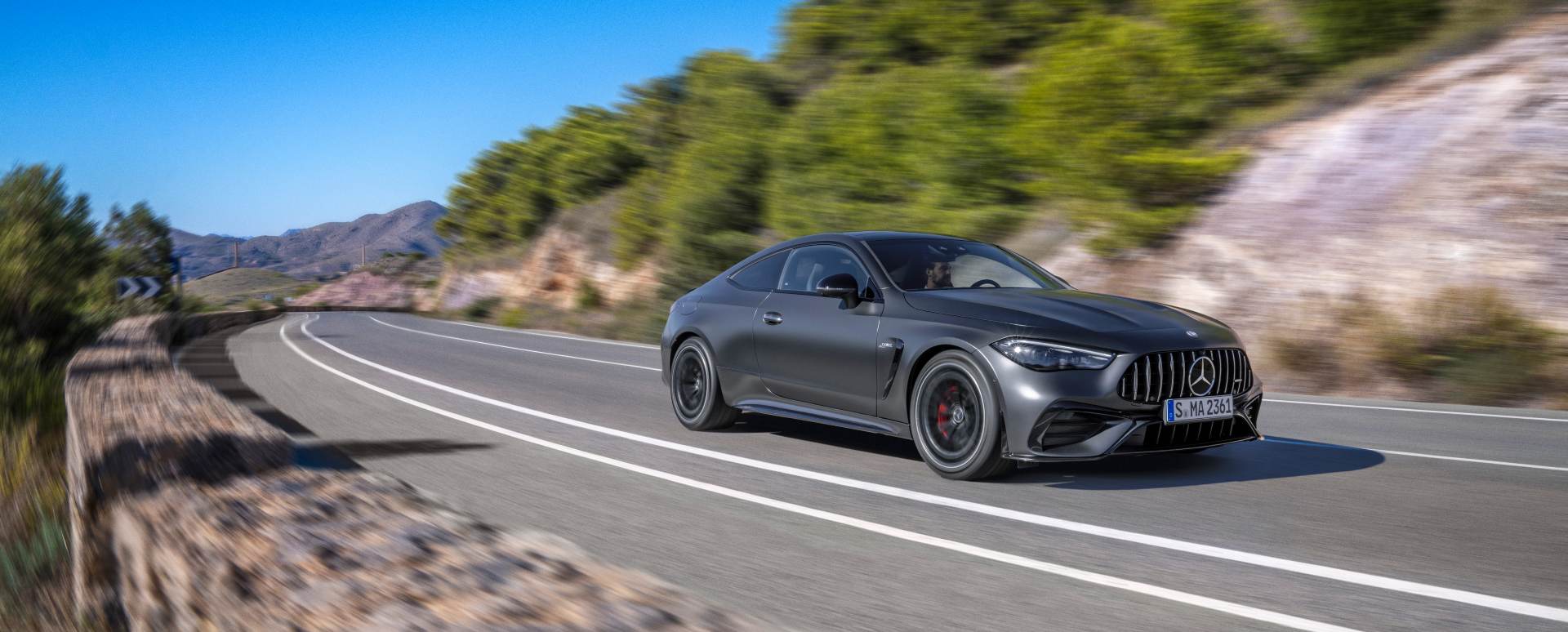Black Mercedes-AMG C-Class Exterior Front Driving Country Road
