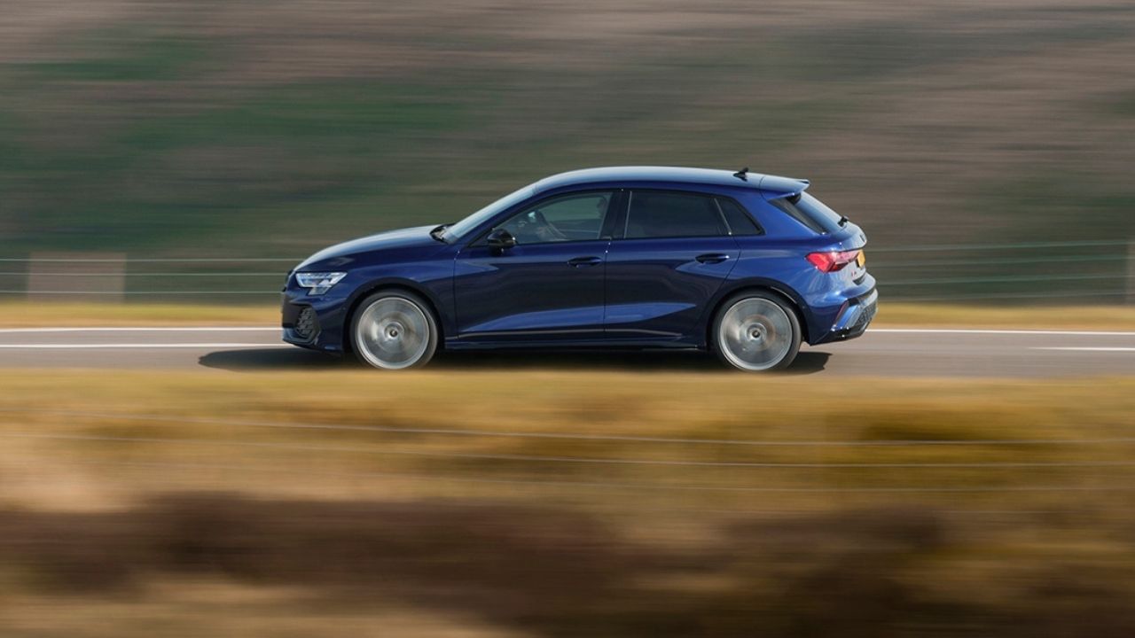 Blue Audi A3 driving in the countryside