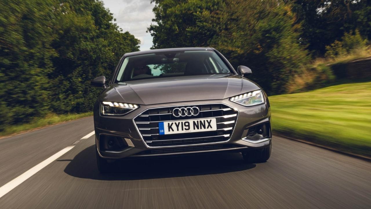 Grey Audi A4 driving in the countryside