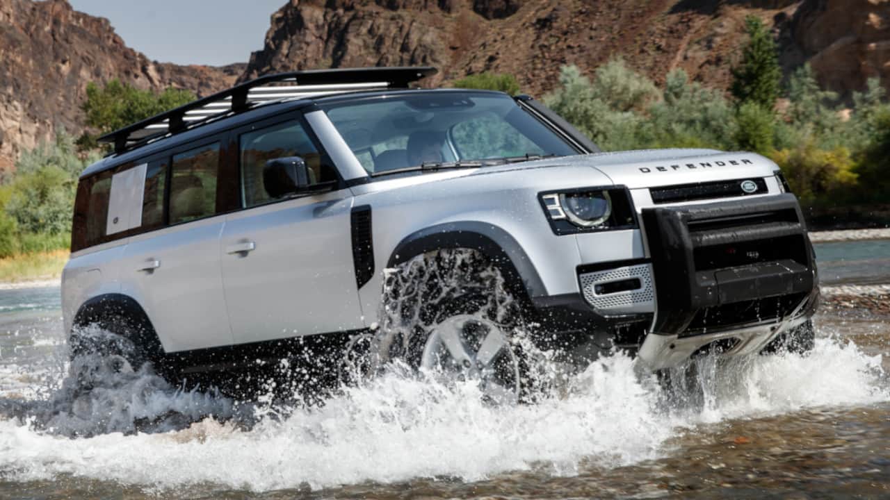 Land Rover Defender Coming Out of Water