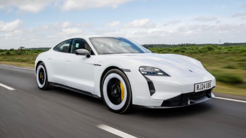 Porsche Taycan Turbo S in White Driving Front Angle