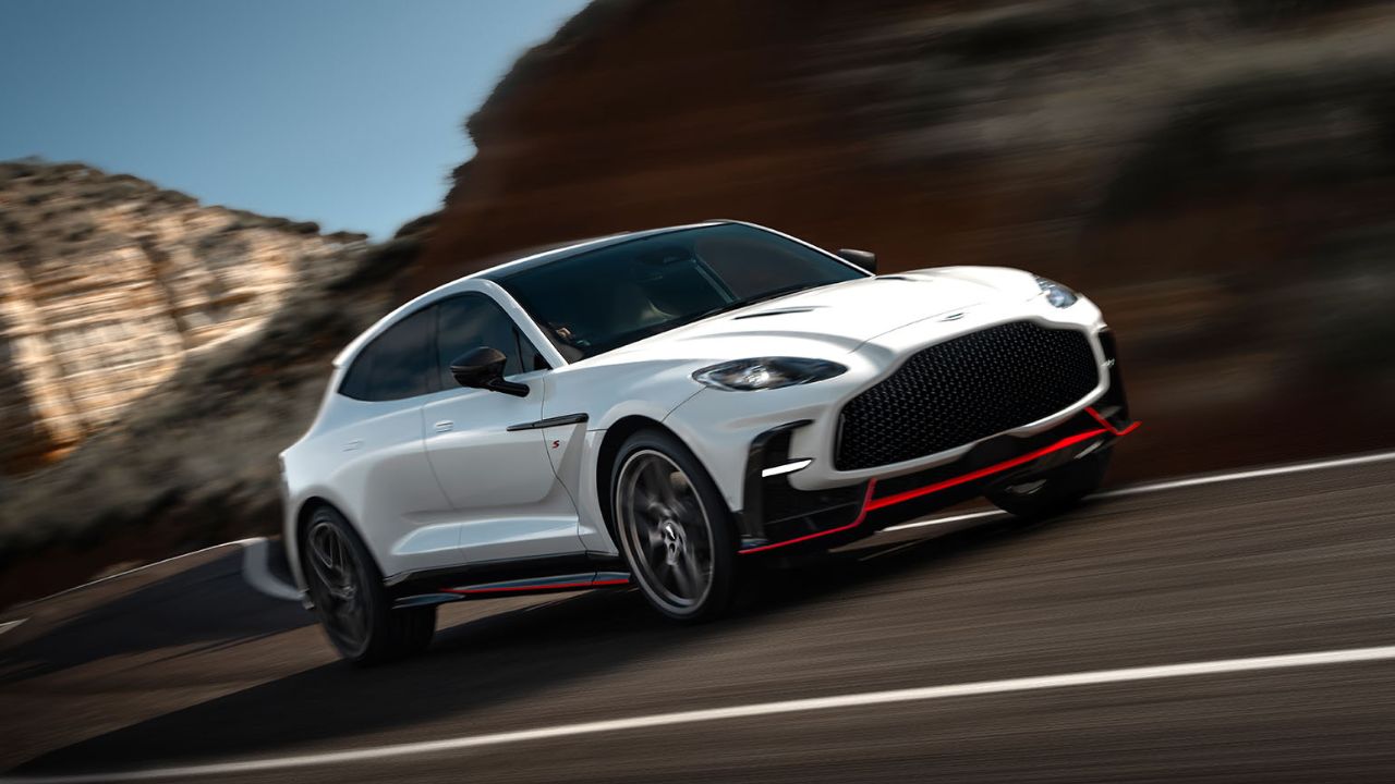 White Aston Martin DBX driving on the road
