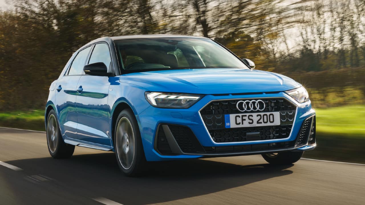 Blue Audi A1 driving in the countryside