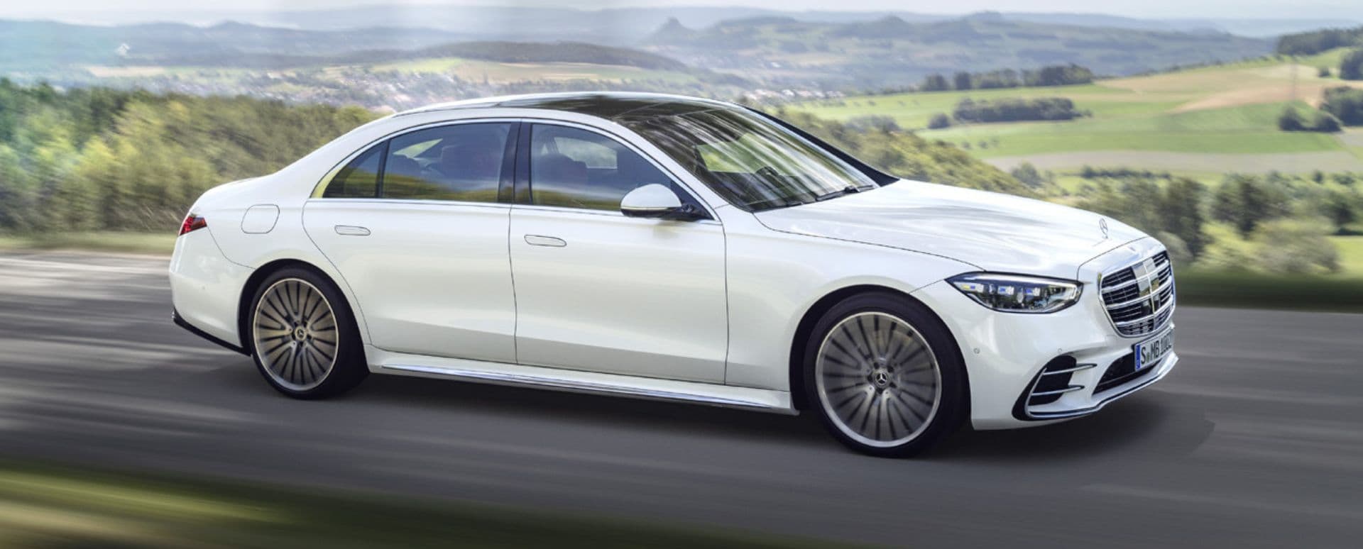 White Mercedes-Benz S-Class driving on the motorway