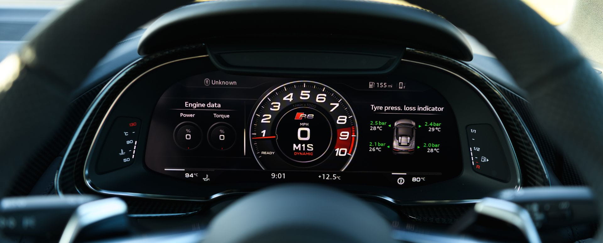 Audi virtual cockpit seen through the steering wheel