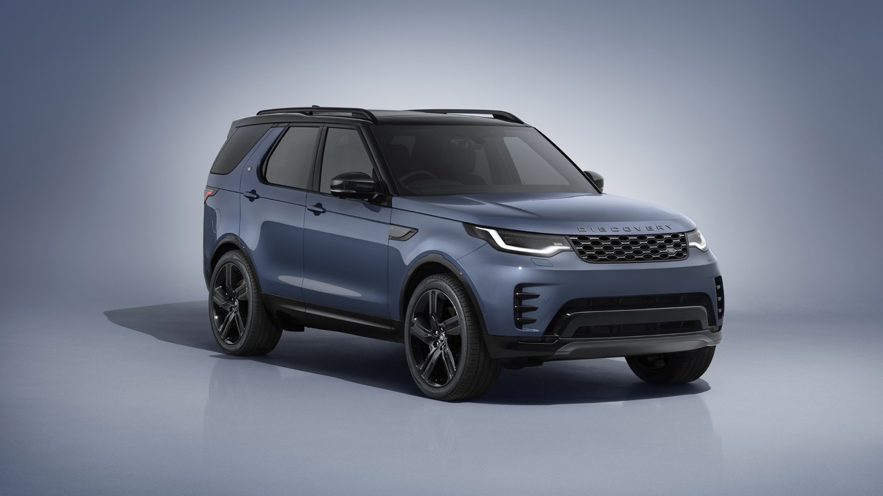 Blue Land Rover Discovery studio shot showing front and side profile
