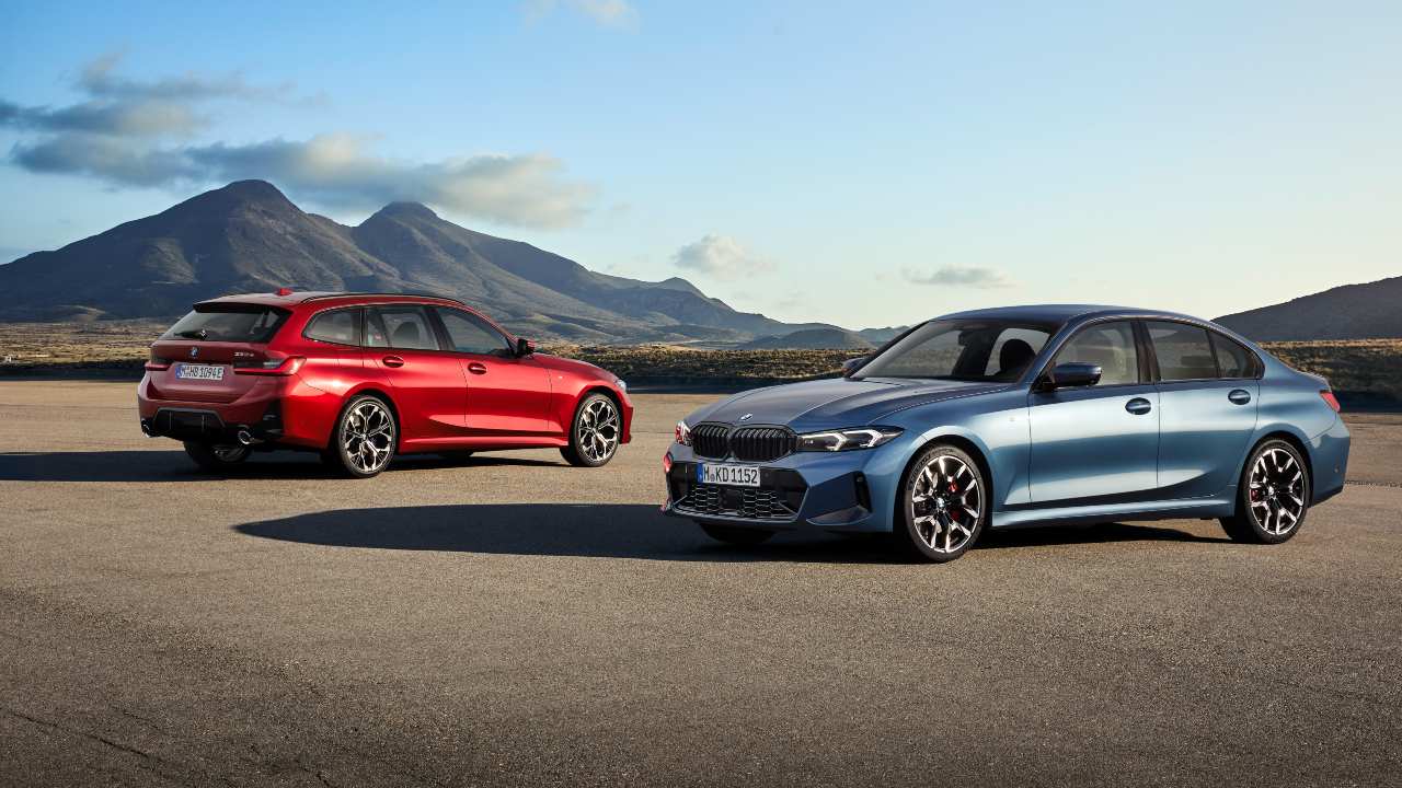 BMW 3 Series Saloon and Touring models parked against a mountainous backdrop