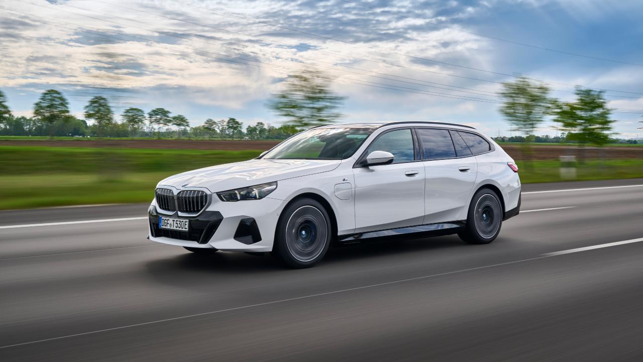 White BMW 5 Series Touring Exterior Front Driving