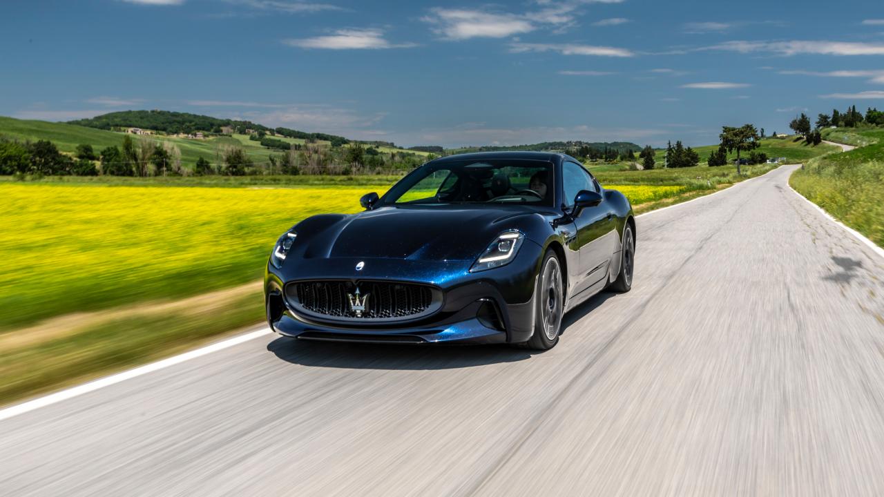 Blue Maserati GranTurismo Folgore Exterior Front Driving Countryside