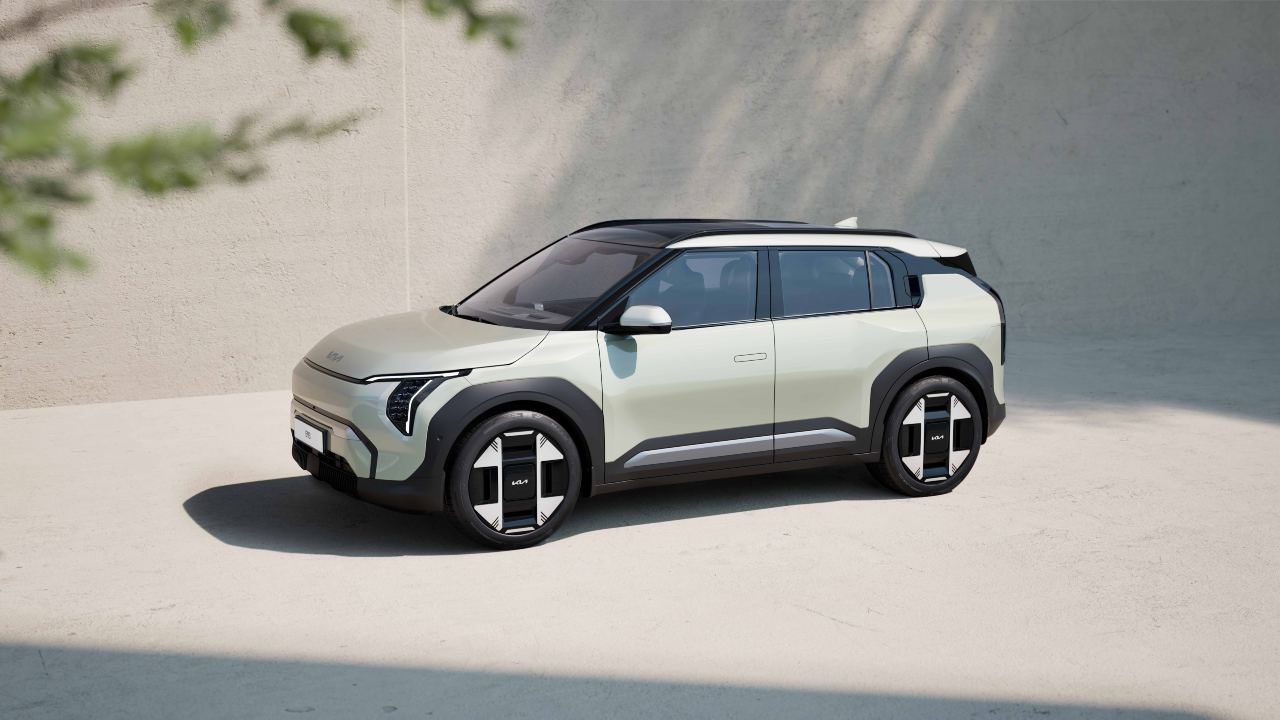 Kia EV3 electric SUV shown from a front three‑quarter angle in a minimalist outdoor setting