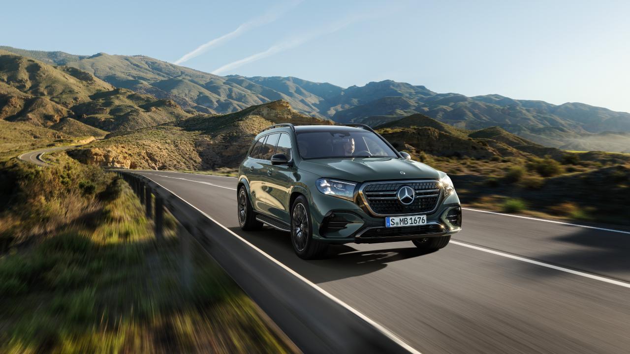 Mercedes-Benz GLS driving on open road through mountainous scenery