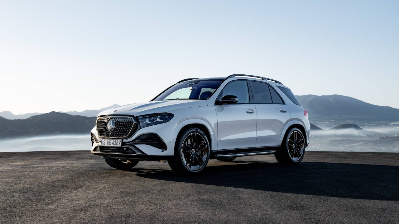Mercedes-Benz GLE SUV parked with mountain backdrop, front three-quarter view