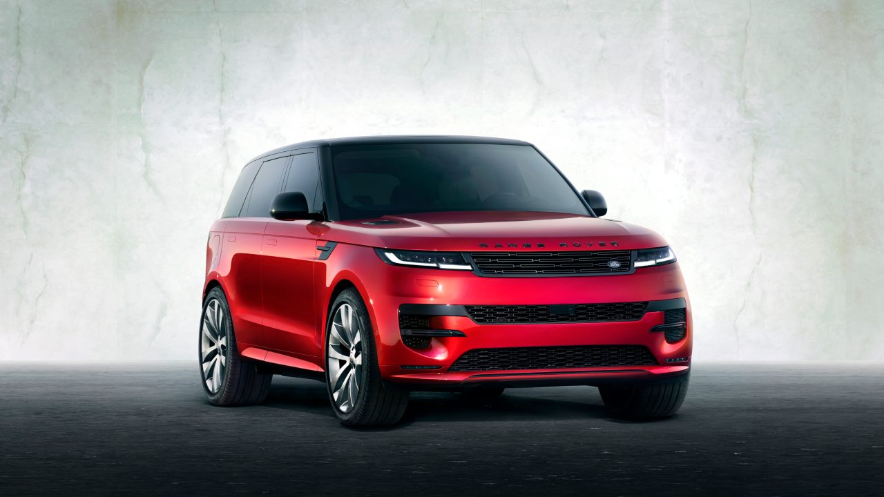 Red Range Rover Sport SUV studio front three-quarter view
