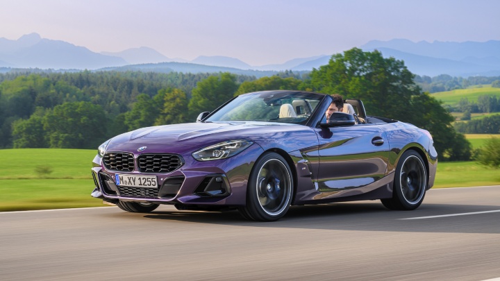 BMW Z4 purple driving with roof down