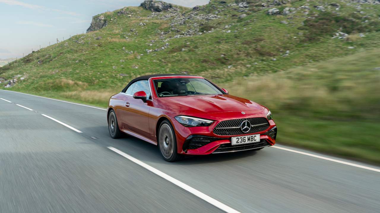 Red Mercedes-Benz CLE front driving with roof up