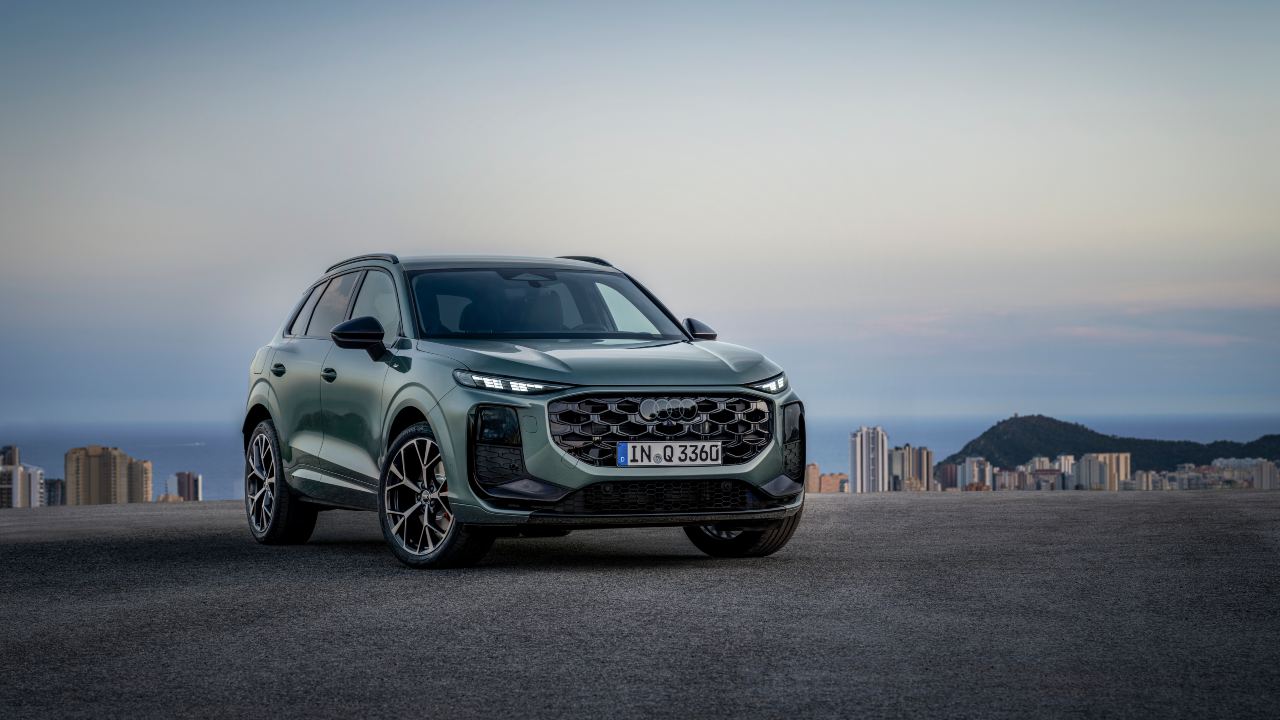 Green Audi Q3 front left angle