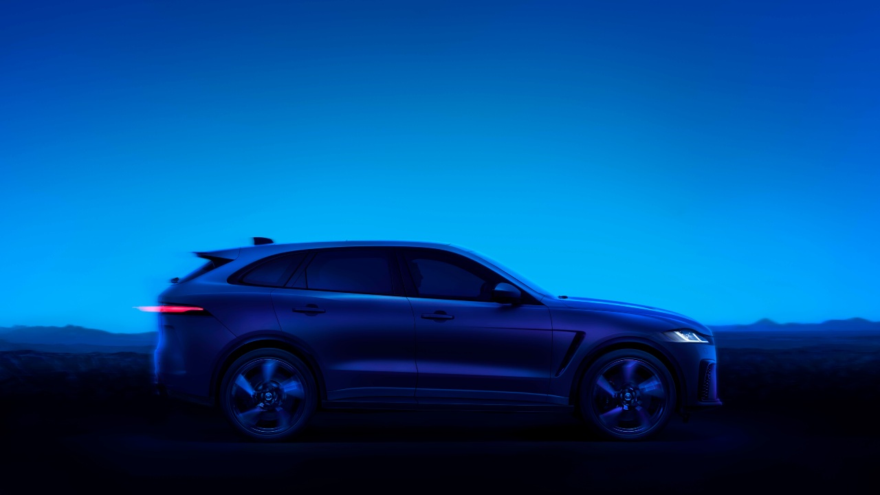 Blue Jaguar F-PACE dark blue sky
