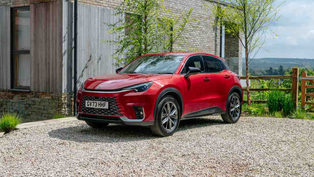 Red Lexus LBX Static in front of house