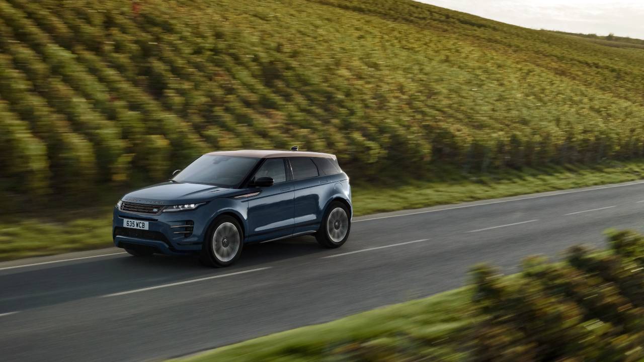 Grey Range Rover Evoque driving country road